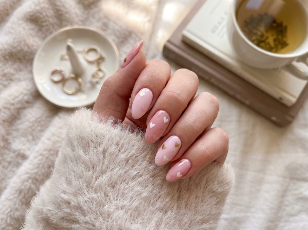 “cute pastel pink nail designs with tiny hearts, soft aesthetic background, feminine style, high quality, Pinterest style”